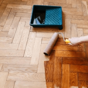Herringbone hardwood floor being refinished